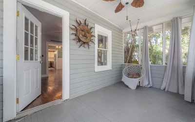 A screened in porch welcomes you home.
