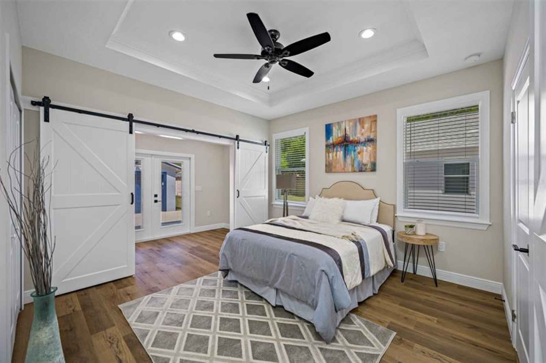 Master Bedroom with Barn doors that flow into attached private office space.
