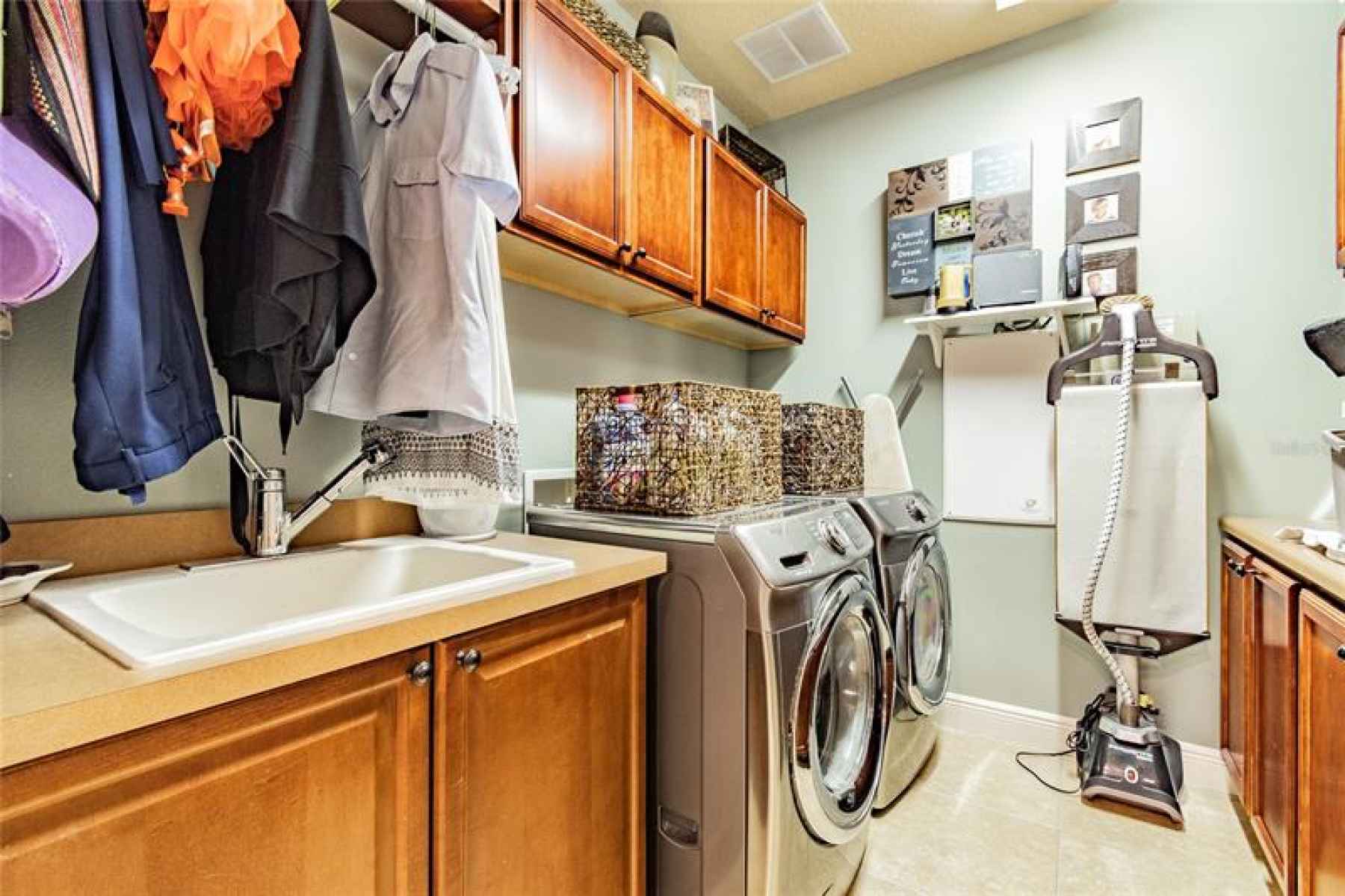 Laundry room off kitchen and garage