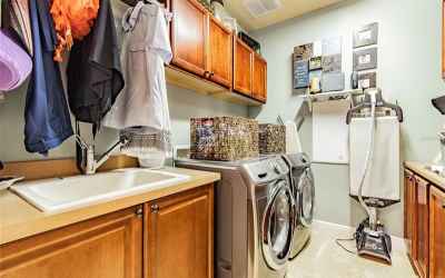 Laundry room off kitchen and garage