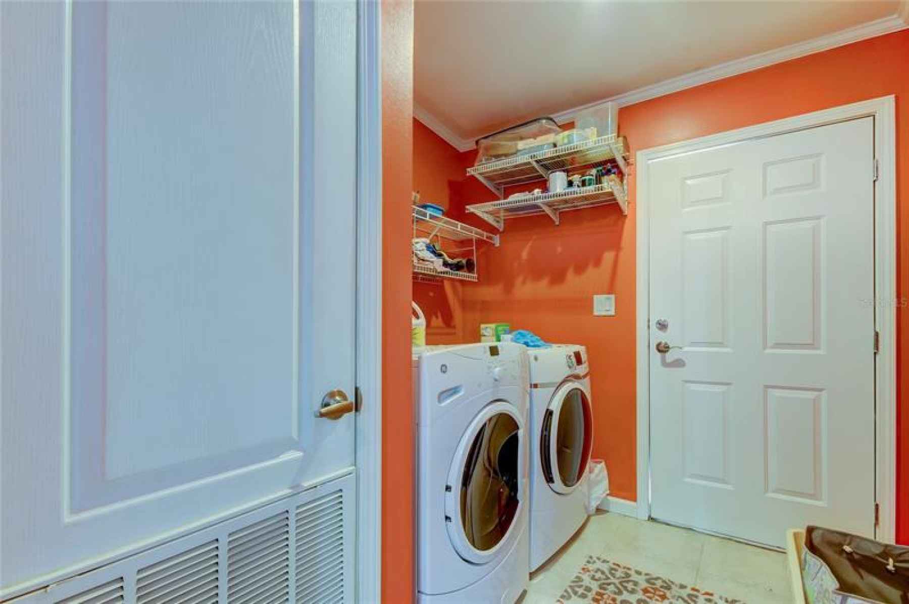 VERY SPACIOUS LAUNDRY ROOM WITH ACCESS TO THE SIDE OF THE HOME!
