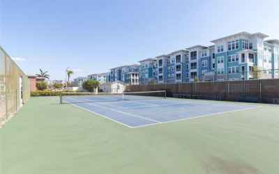 Tennis courts.  New luxury apts in background.