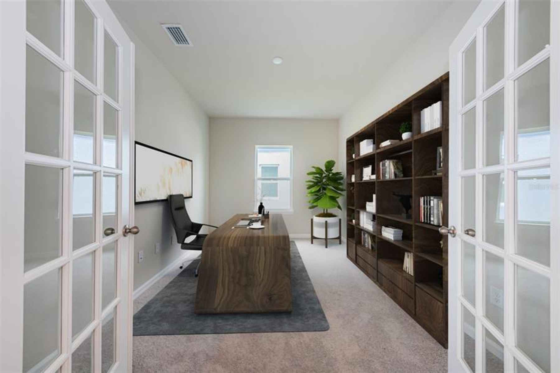 Bonus room with French doors located on the first living level is perfect for a home Office, a Den o