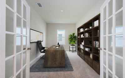 Bonus room with French doors located on the first living level is perfect for a home Office, a Den o