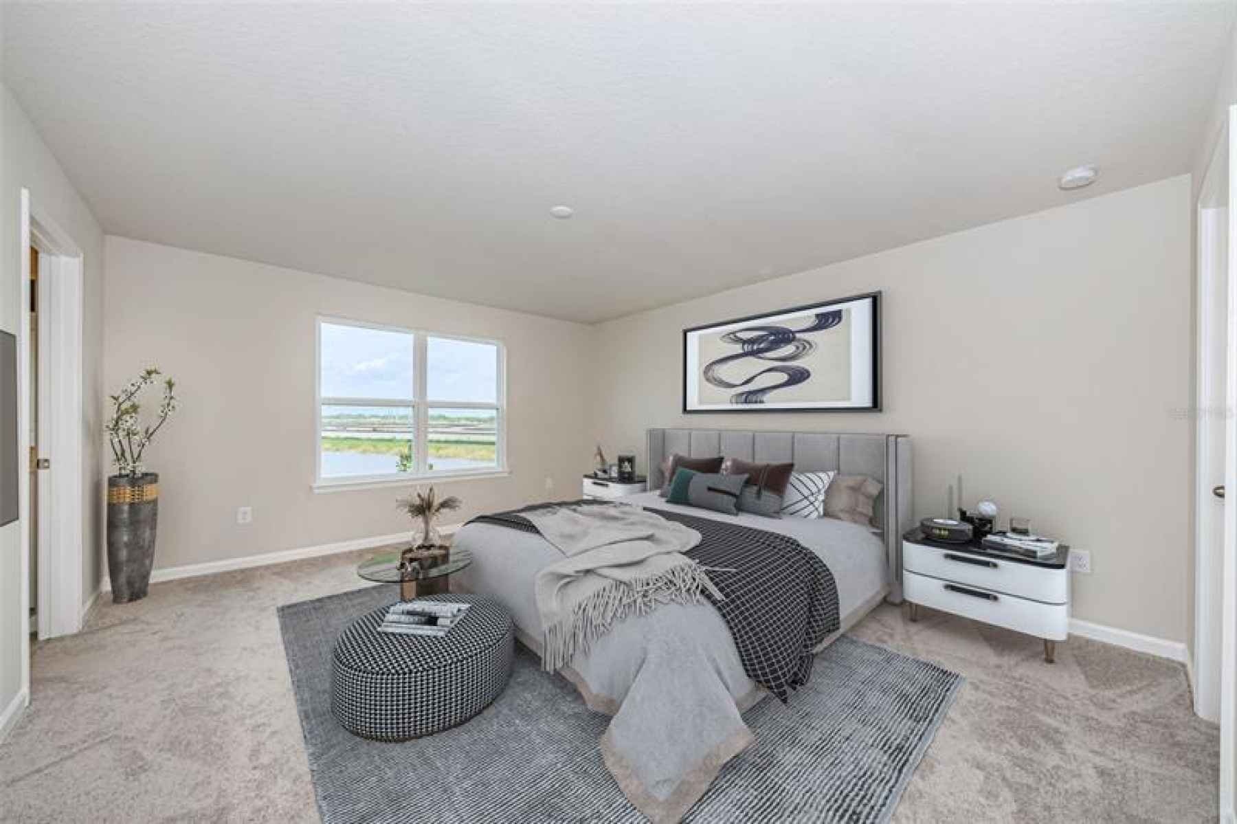 A spacious Owner's suite on the 2nd living level offers lots of natural light and views of the pond