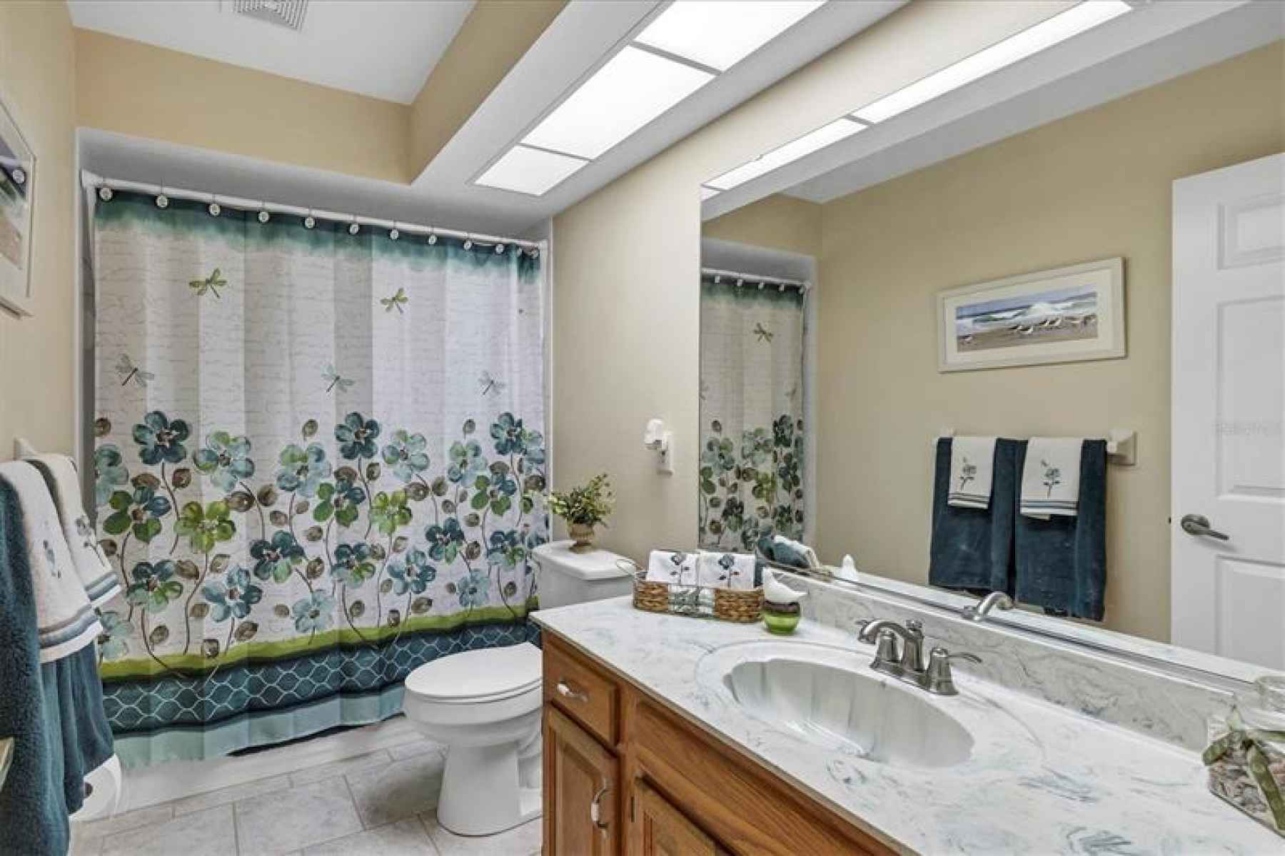 Hall bath that serves the second and third bedrooms
