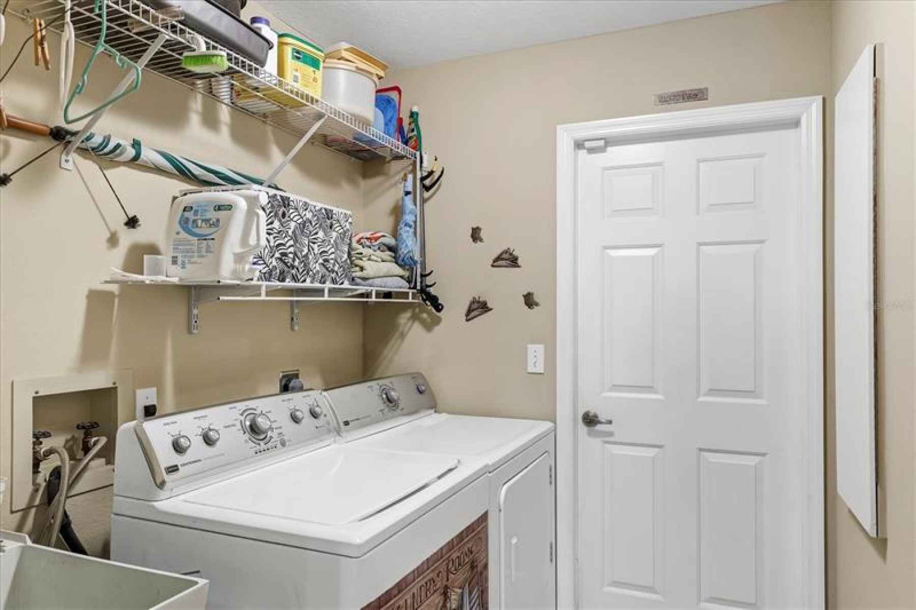 Interior laundry room.  Appliances stay with the home