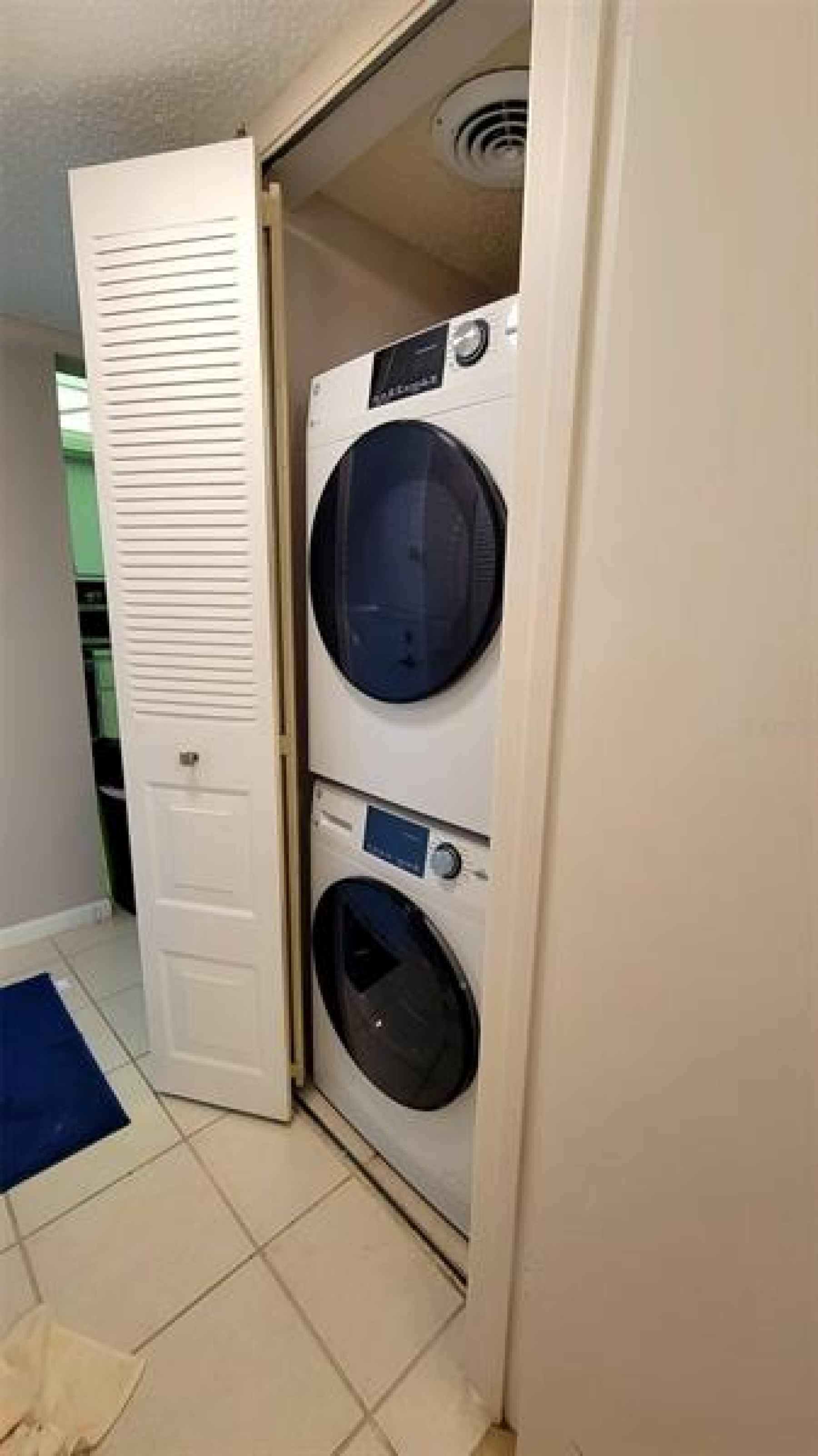 2021 Washer/Dryer in hallway by half bathroom.