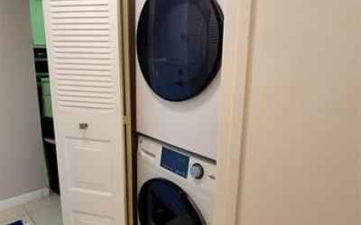 2021 Washer/Dryer in hallway by half bathroom.