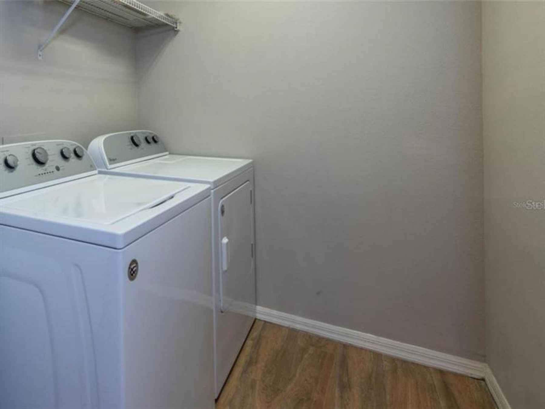 The upstairs laundry room is between the bedrooms for more privacy. Also, you don't have to run up a