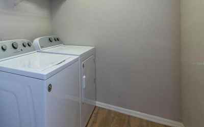 The upstairs laundry room is between the bedrooms for more privacy. Also, you don't have to run up a