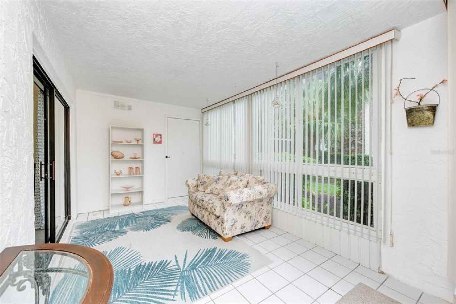 Nice oasis to sit and have your morning coffee.  Large storage closet behind the door.